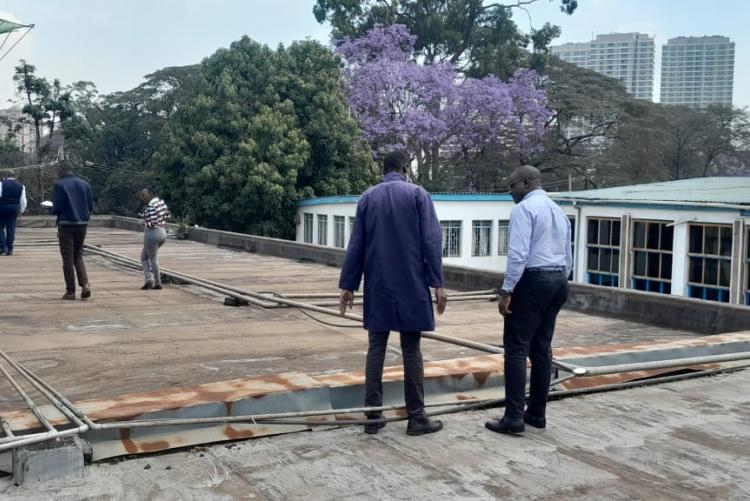 Prof. Obimbo M.M and contractions Management team on top of the Human Anatomy & Physiology building for site inspection