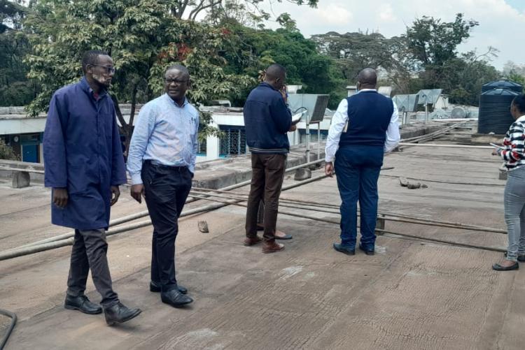 Prof. Obimbo M.M and contractions Management team on top of the Human Anatomy & Physiology building for site inspection