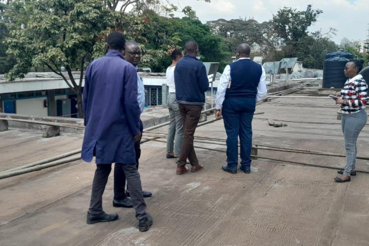 Prof. Obimbo M.M and contractions Management team on top of the Human Anatomy & Physiology building for site inspection