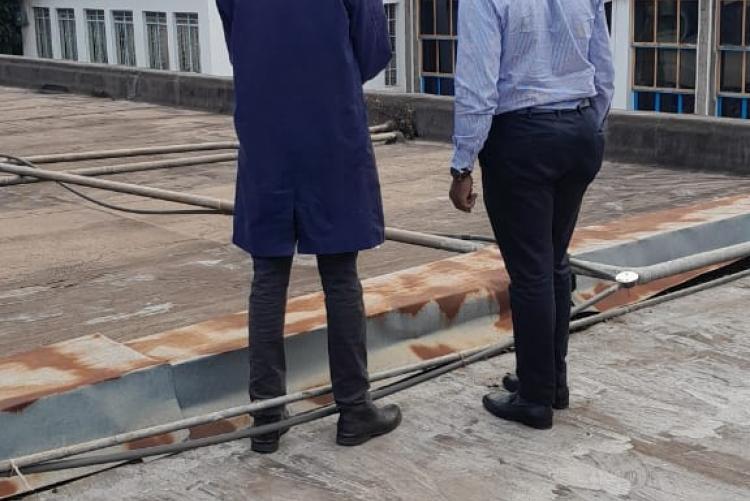 Prof. Obimbo M.M and contractions Management team on top of the Human Anatomy & Physiology building for site inspection