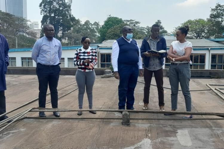 Prof. Obimbo M.M and contractions Management team on top of the Human Anatomy & Physiology building for site inspection